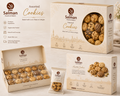 Assorted cookies in maroon bakery box